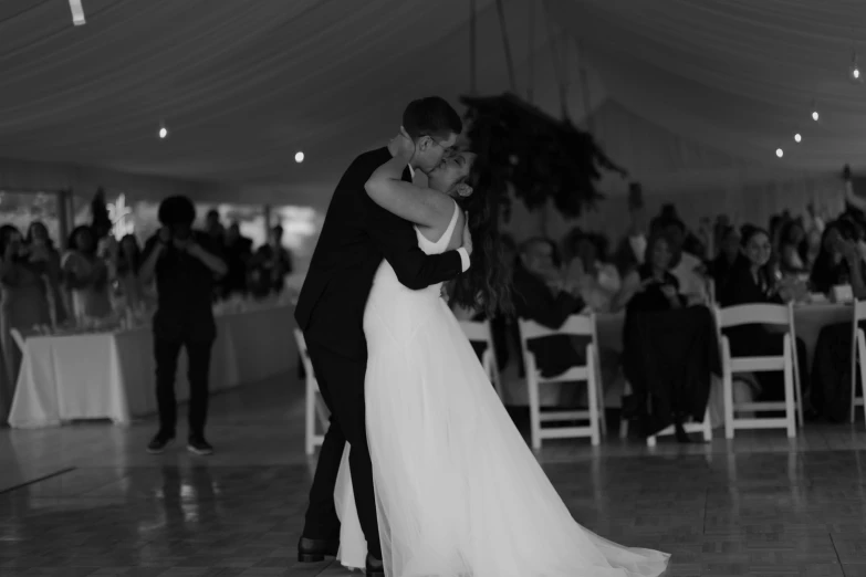 a man and woman dance together on a dance floor