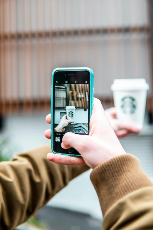 a person is holding a smart phone in their hands