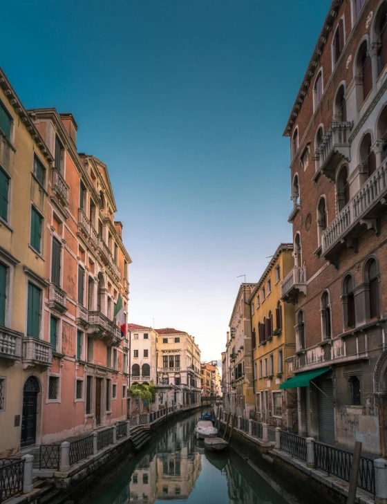 a view of some buildings and water on a street