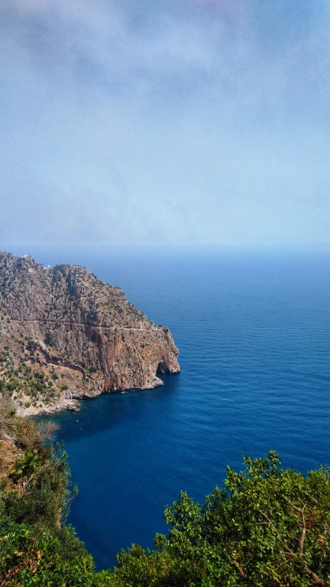 a large body of water near a forest