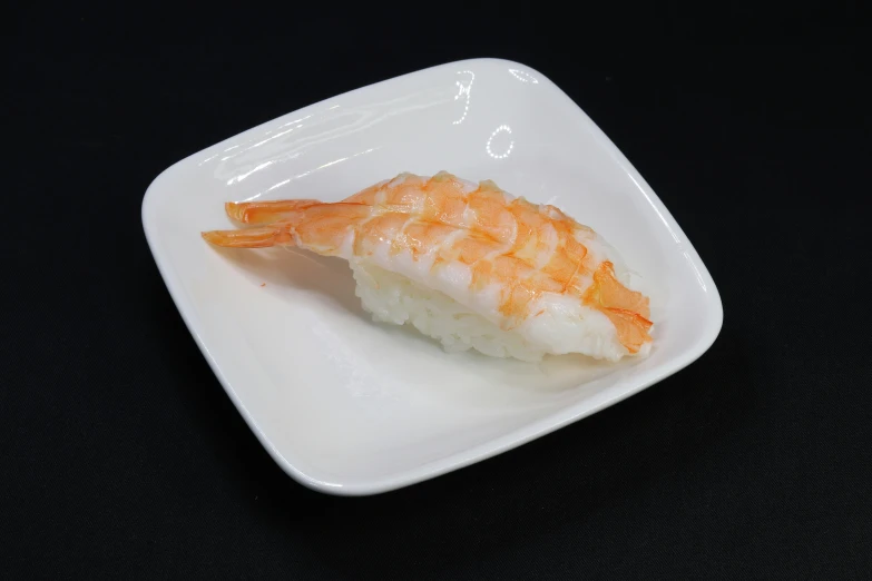 there is a slice of sushi on the plate