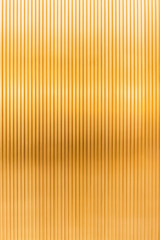 a very shiny gold wall with some lines on it