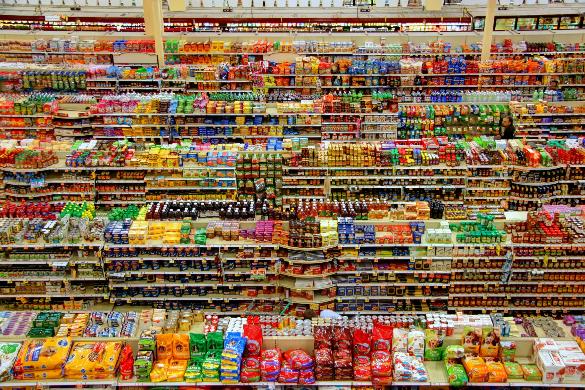 a large grocery aisle of various foods and drinks