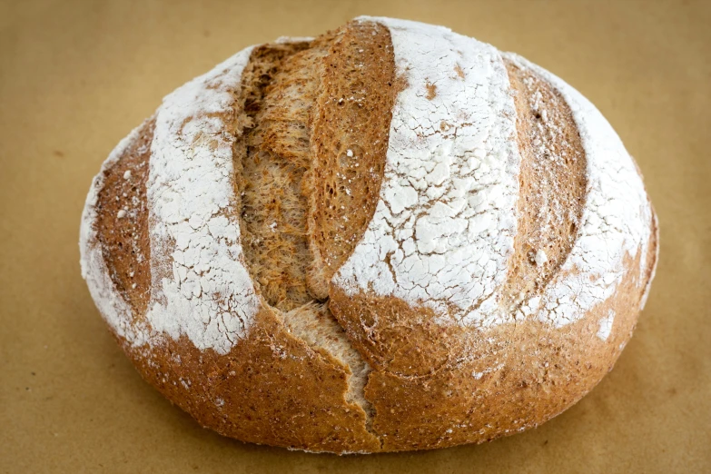 a bread loaf is being eaten on the table