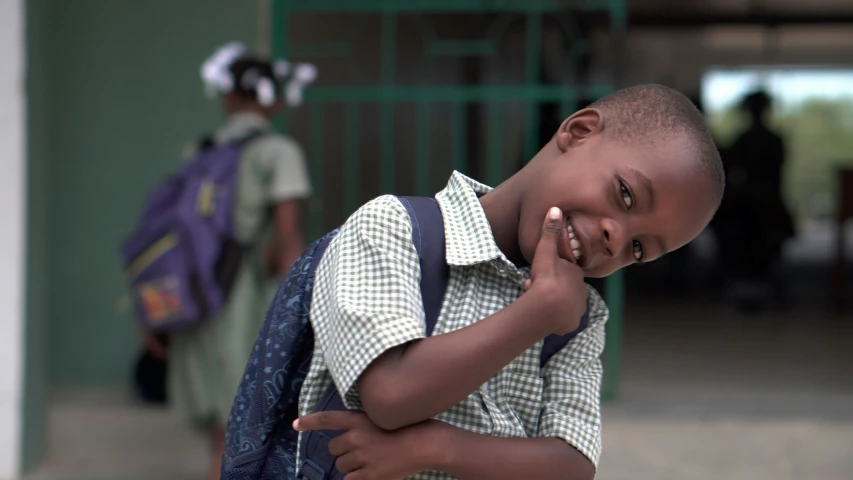 a young child is laughing for the camera