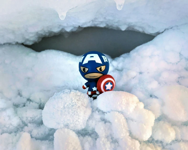 captain america doll sitting in a cloud formation