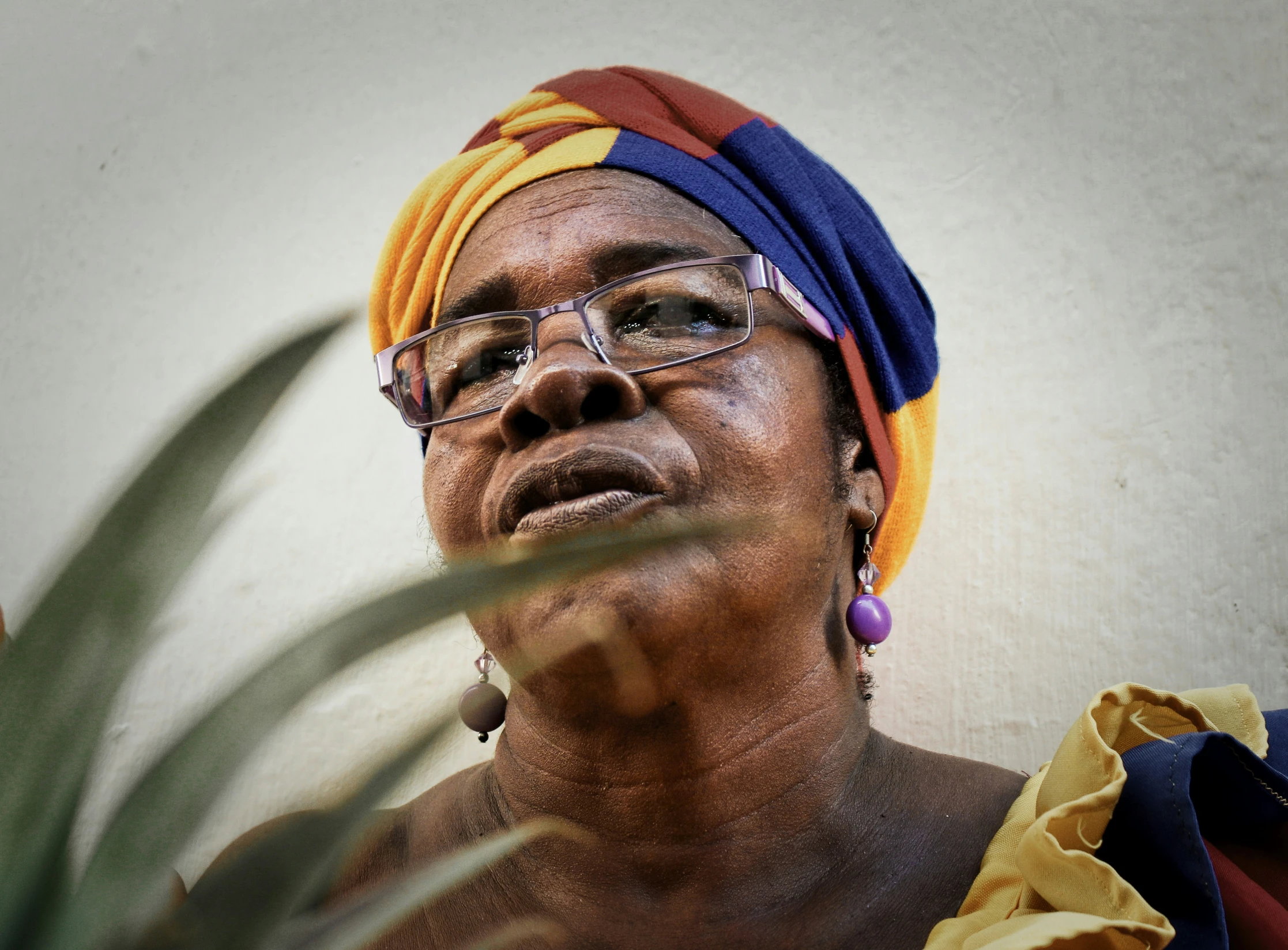 a woman wearing glasses and a turban