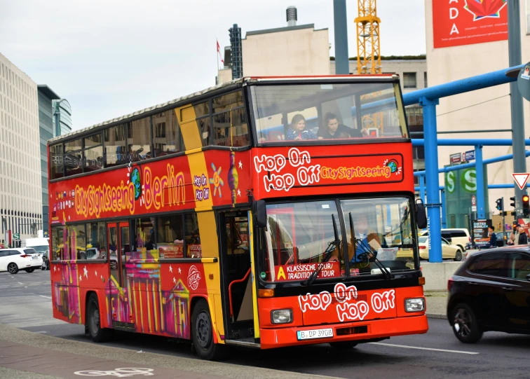 a double decker bus drives down a busy city street