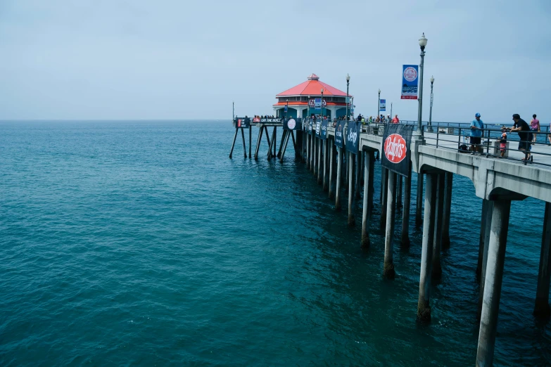 a pier in the ocean next to a dock for people