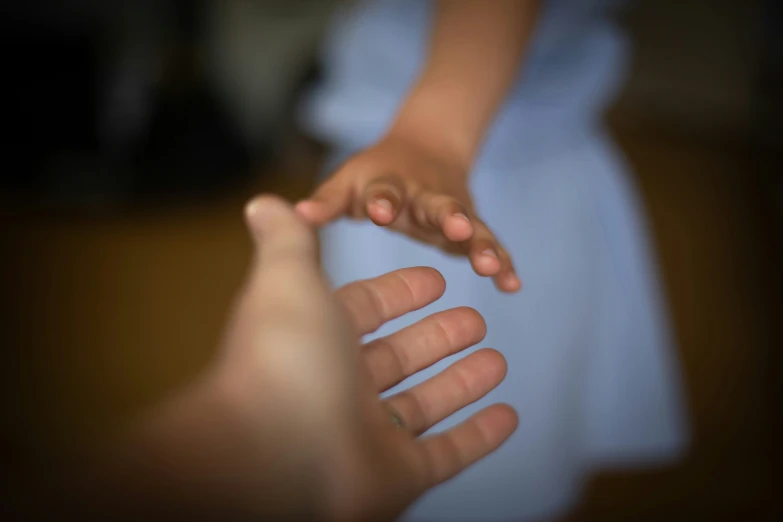 the hands of two people that are reaching for soing