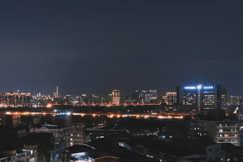 a city view of the lights from a nearby high rise