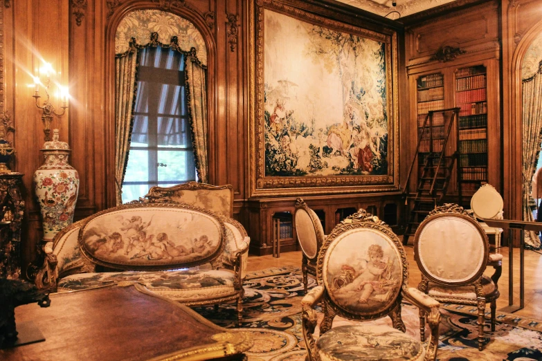 ornate living room with ornate walls and a tapestry