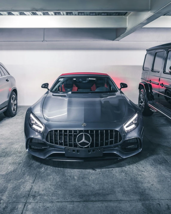 two different types of cars parked inside a building