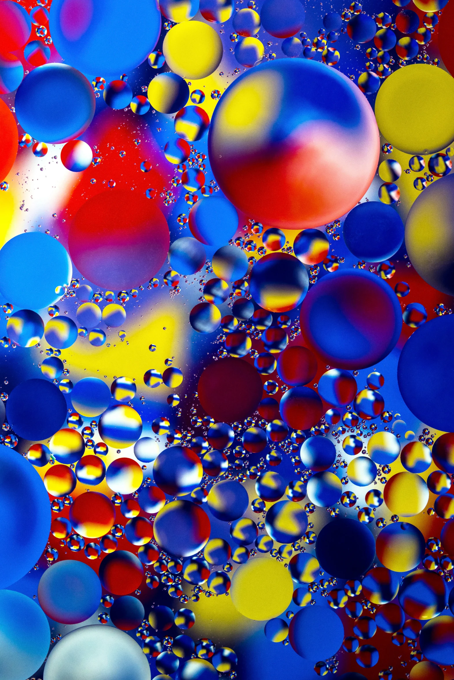 liquid bubbles that are blue, yellow and red