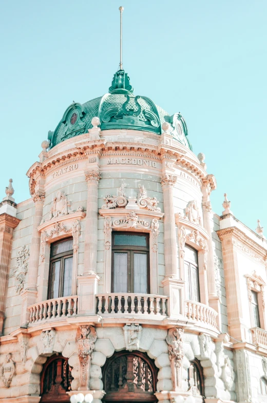 a very old style building with a clock tower