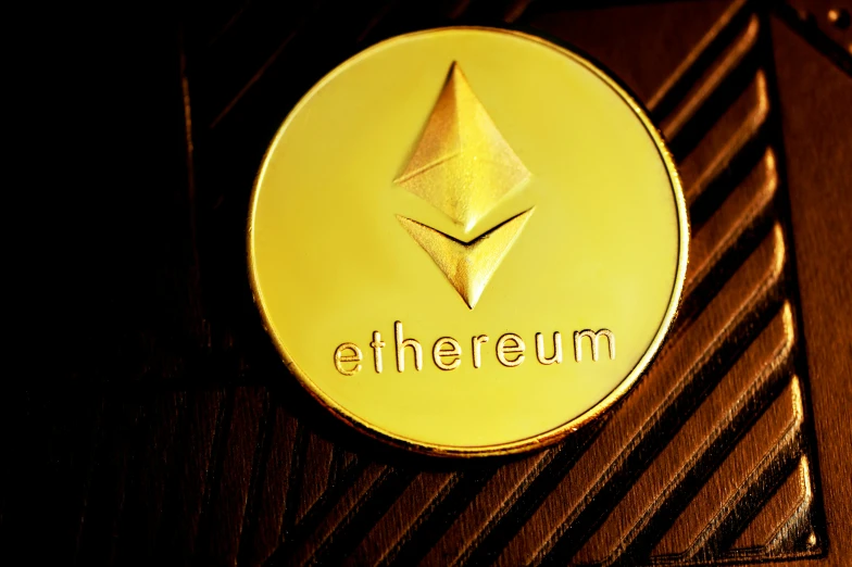 a close - up of a yellow token with etherum letters