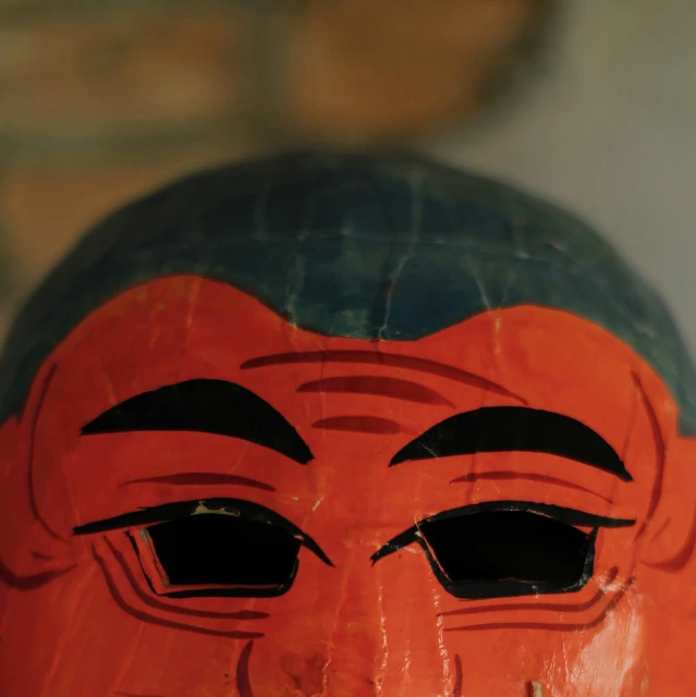 an image of a hand made wooden mask