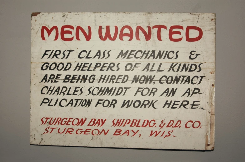 a sign on the wall explaining some type of men wanted