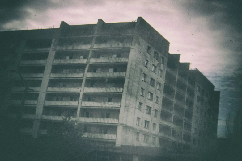 an abandoned building on the side of a street with no parking signs