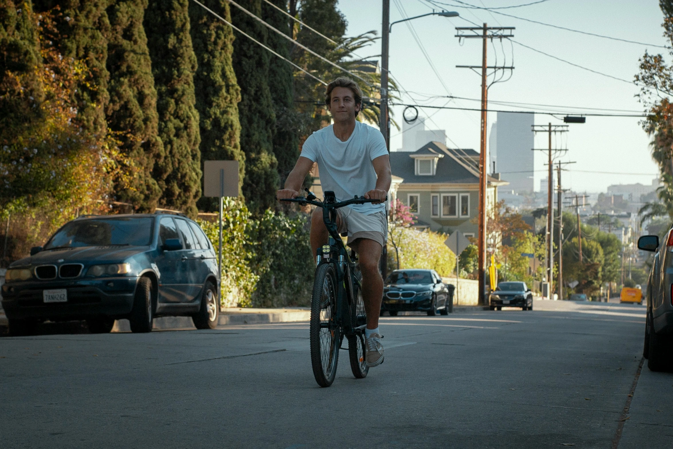 a man riding a bike down a street