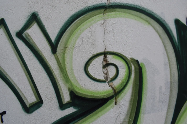 a wall with some graffiti on it with words that appear as if letter h and k