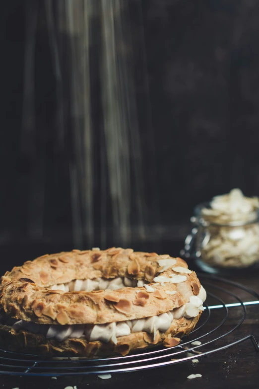 a cake is cooling on a black wire rack