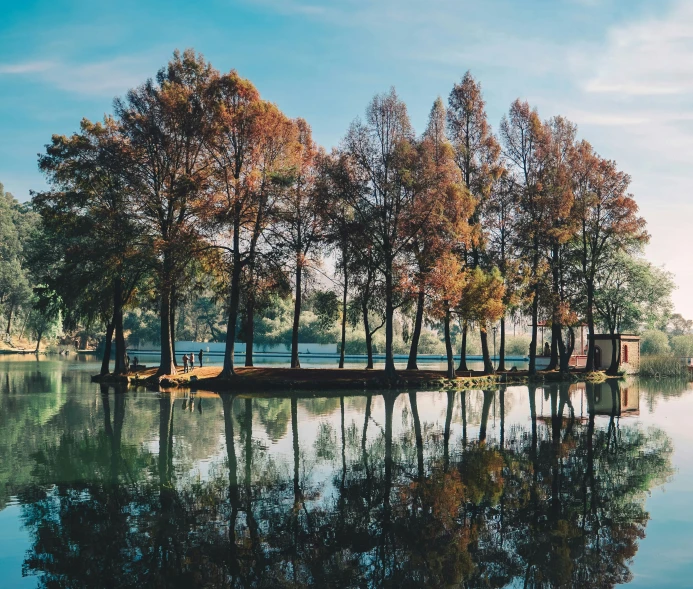 a small pier sitting in the middle of a lake