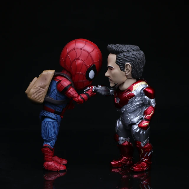 the statue is being touched by a spider man
