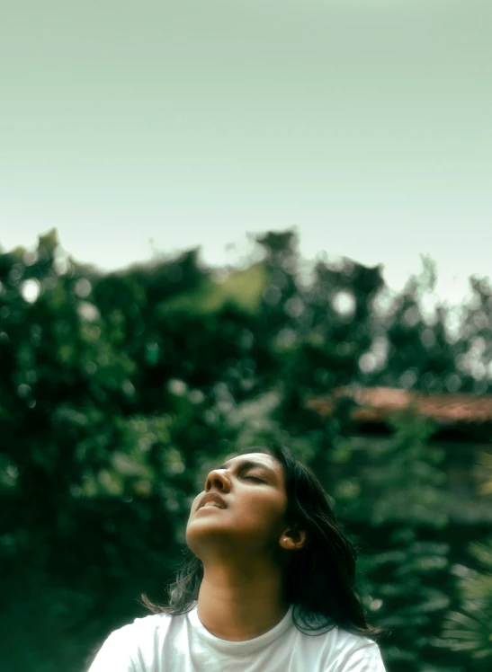 woman in white shirt smiling for a kite