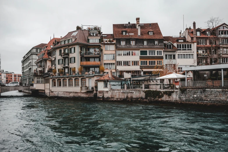 the buildings along the side of the water are very old