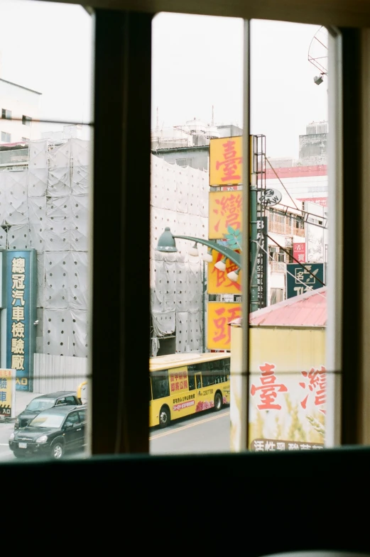 city view through window with car on street