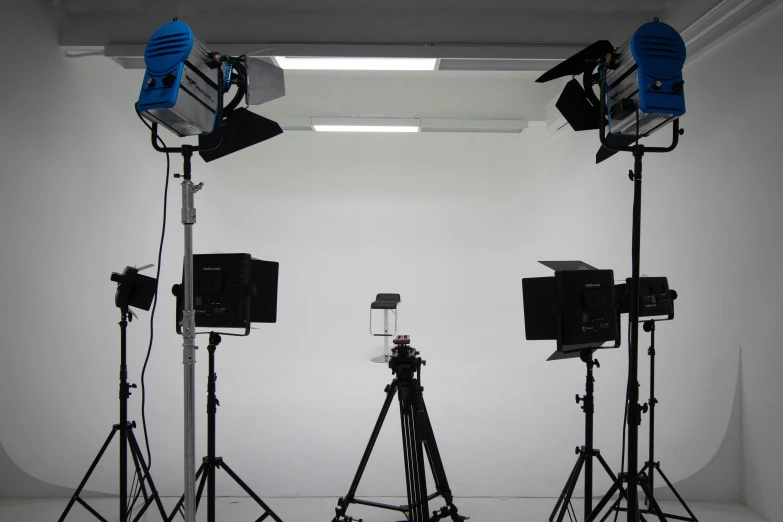 a white wall with lights and cameras