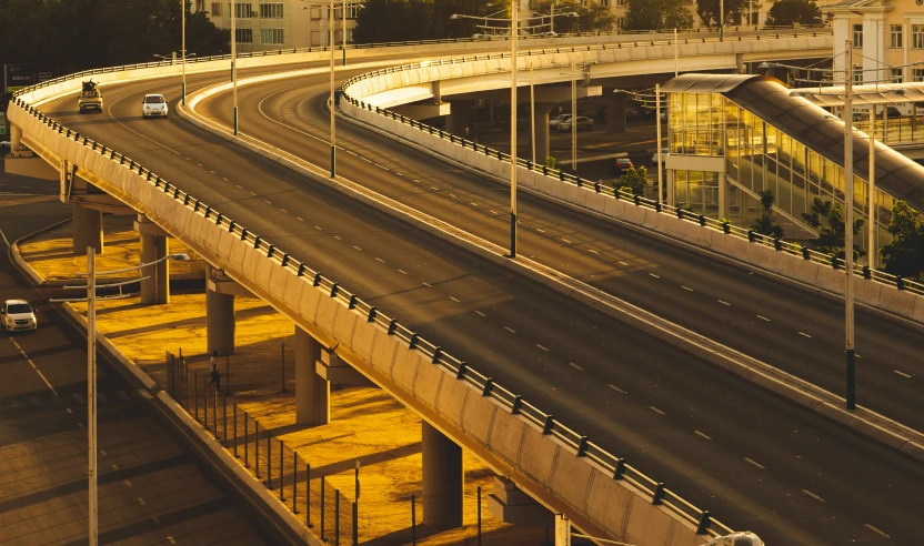 a freeway is pictured as it goes under a bridge