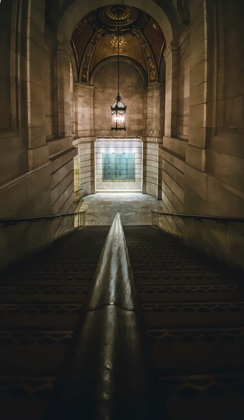 an empty, dark and dim church room with stairs