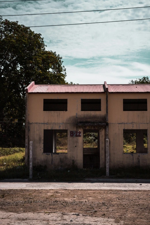 a abandoned building near the side of a road