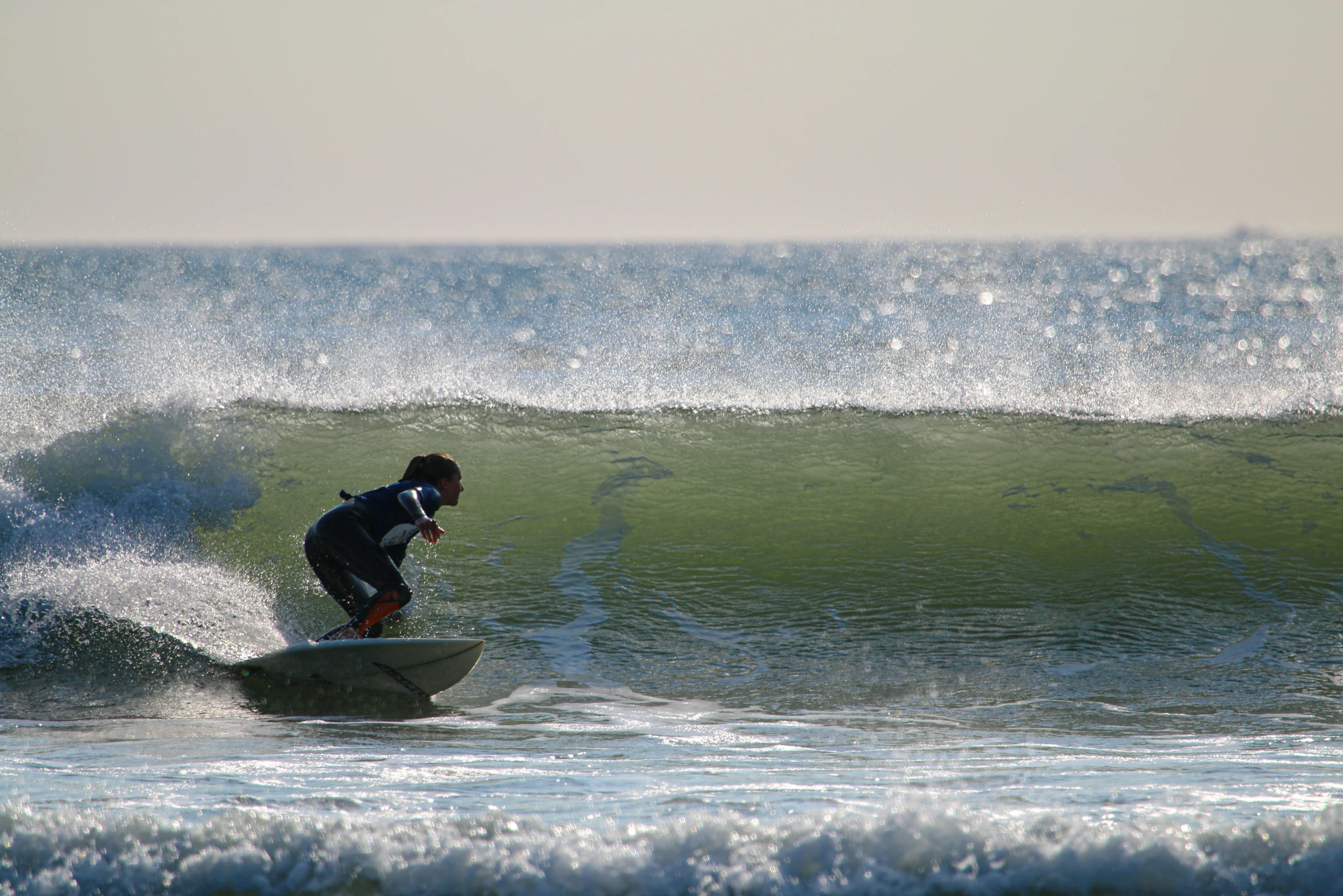 a man surfing with a lot of white water behind him