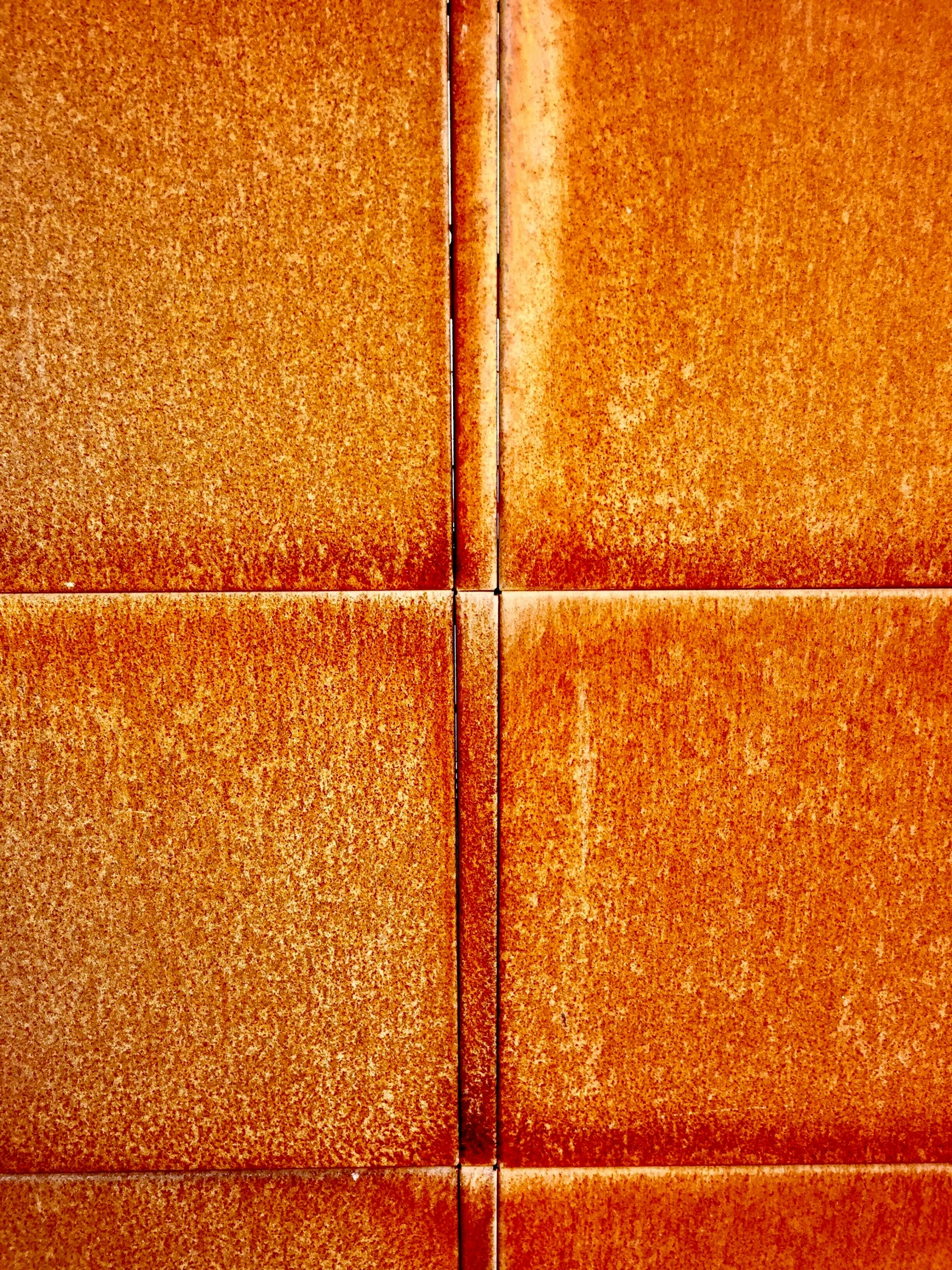 closeup of orange wall, with one side partially exposed