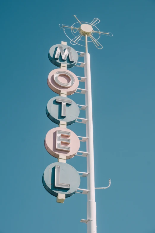 the top of a metal sign with circular and circle symbols on it