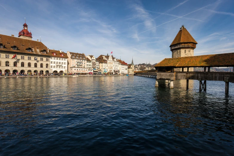 the water in front of some houses on the river