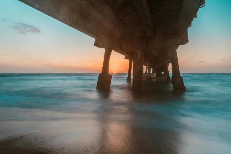 some water a pier and a body of water