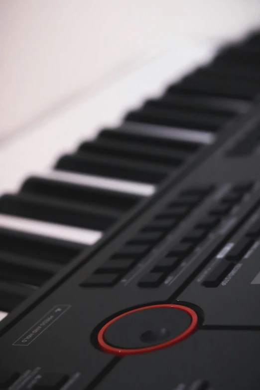 close up view of the keys and rim of a black piano