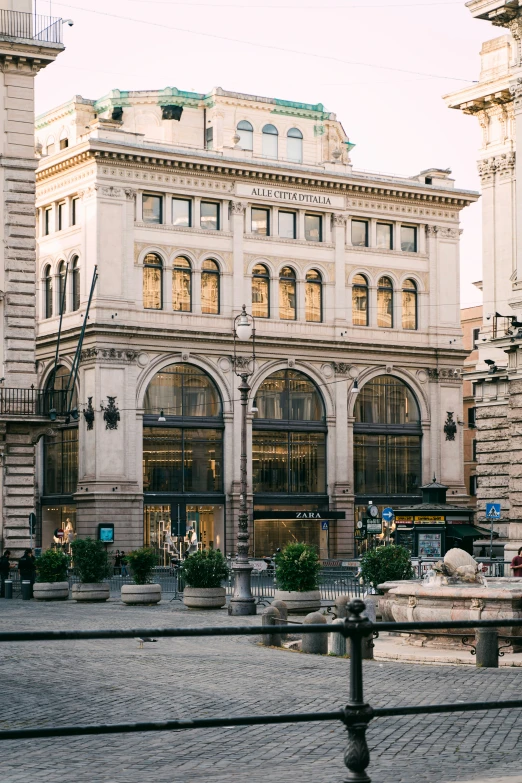 two large building near each other on a city street