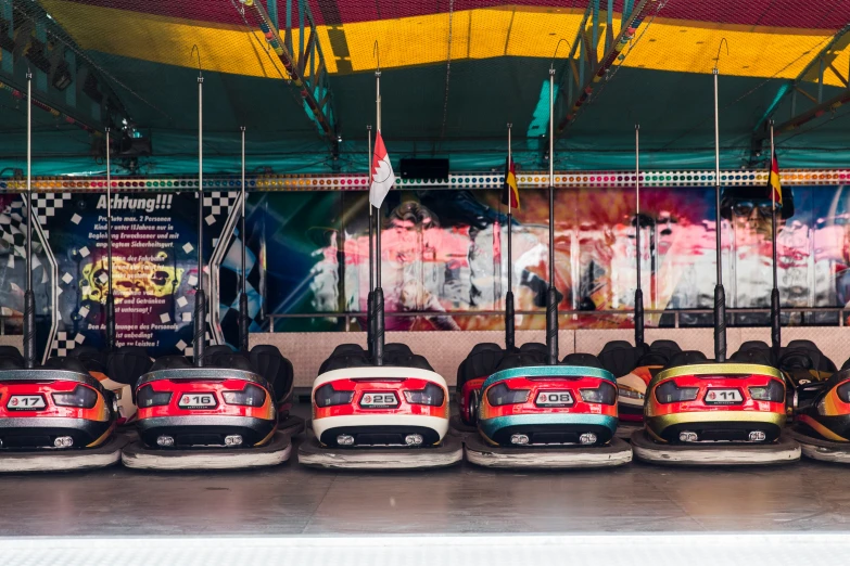 some bumper cars in line at the carnival