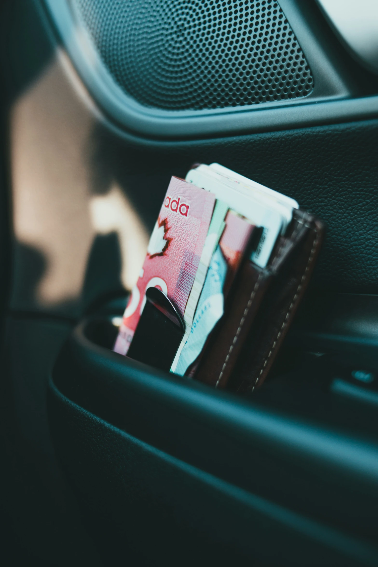 a close up of money sticking out of a wallet