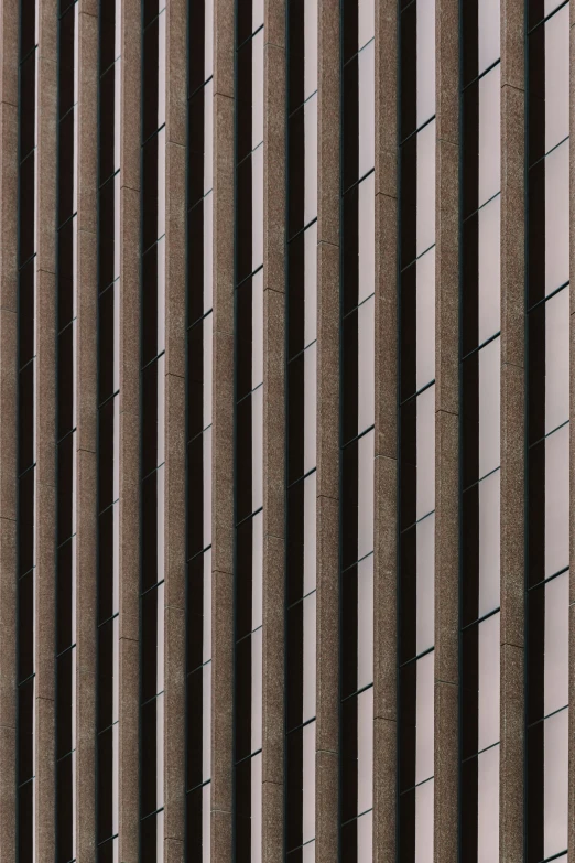 the side of a building is lined with brown bricks