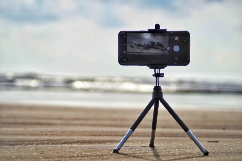 a camera standing on top of a tripod