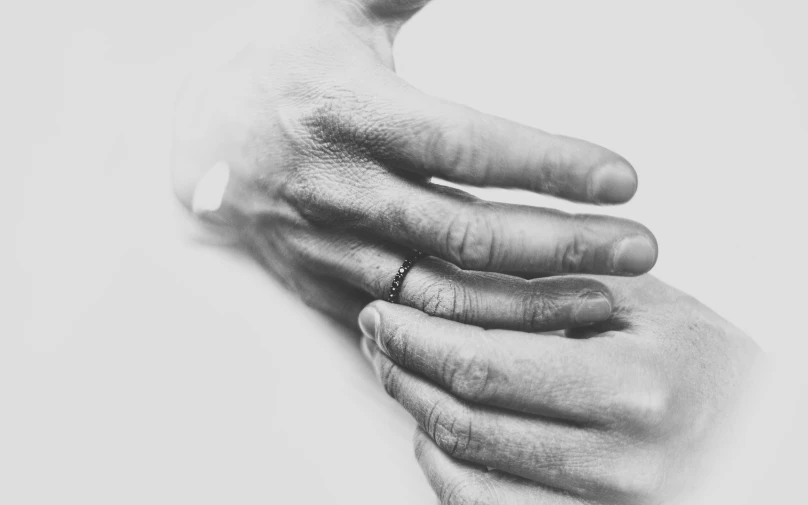 an image of someones hands holding onto soing