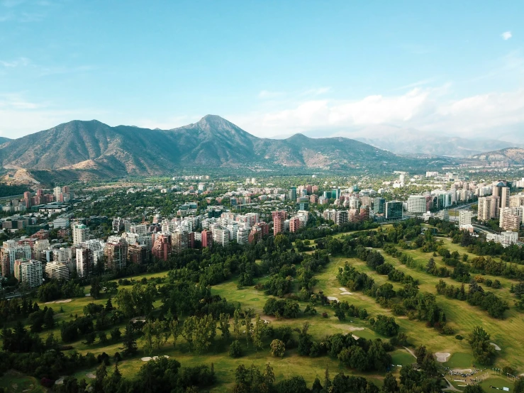 this is a beautiful view of city with mountains in the background