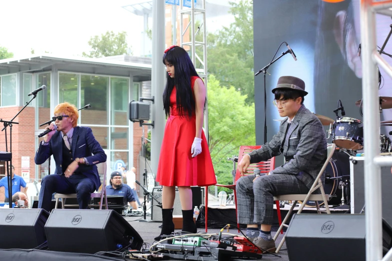 a couple of people that are standing on stage