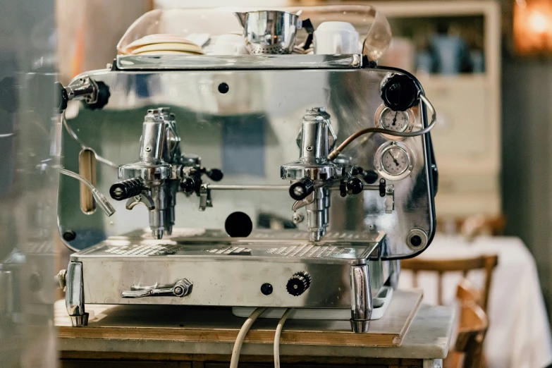 a machine sitting on top of a table with a clock on the side